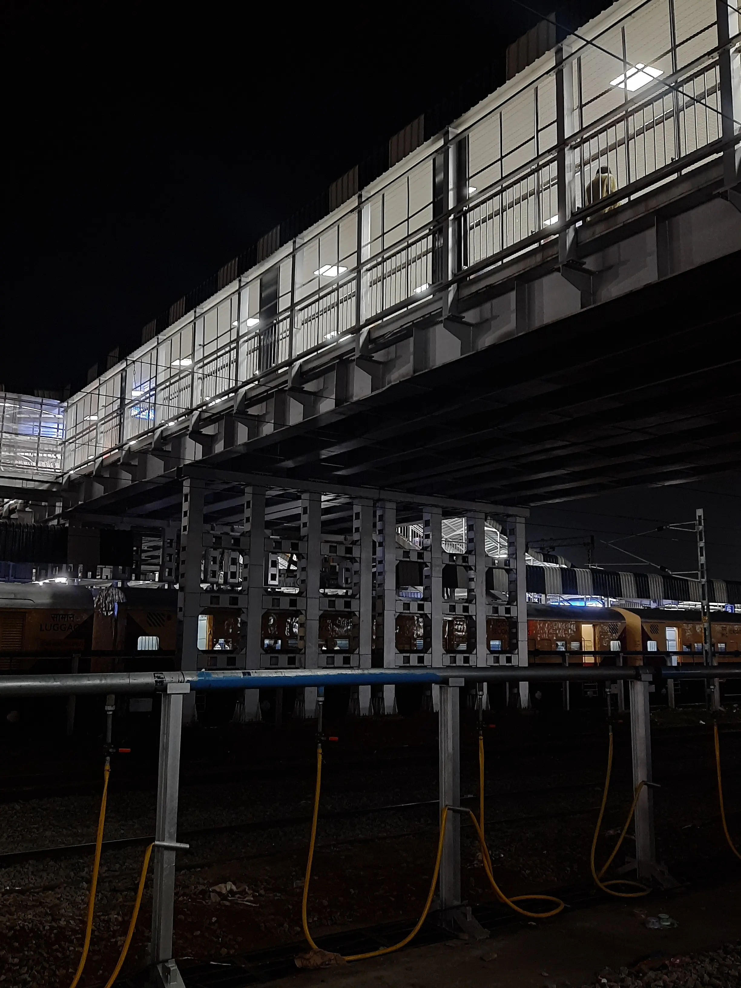 Railway station, bright lights, night